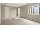 Neutrally painted bedroom with carpeted floors, a window for natural light, and a closet for storage at 6 Westchester Sq, Decatur, GA 30030