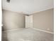 Neutral bedroom with wall-to-wall carpet, white door, and a window providing natural light at 6 Westchester Sq, Decatur, GA 30030