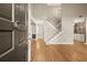 Bright foyer with wood floors, high ceilings, and staircase leading to the second floor at 6 Westchester Sq, Decatur, GA 30030