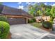 Brick home featuring an attached two car garage and mature landscaping in the front yard at 6 Westchester Sq, Decatur, GA 30030