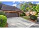 Brick home featuring an attached two car garage and mature landscaping in the front yard at 6 Westchester Sq, Decatur, GA 30030
