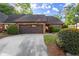 Brick home featuring an attached two car garage and beautifully maintained landscaping at 6 Westchester Sq, Decatur, GA 30030