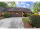 Brick home featuring an attached two car garage and beautifully maintained landscaping at 6 Westchester Sq, Decatur, GA 30030