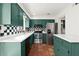 Bright kitchen features modern stainless steel appliances, updated cabinets and countertops, and spacious terra cotta floors at 6 Westchester Sq, Decatur, GA 30030