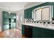 This renovated kitchen features built-in cabinets, modern backsplash and sink, and terra cotta tile floors at 6 Westchester Sq, Decatur, GA 30030