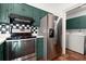 This kitchen boasts a stainless steel oven, fridge, and a connected laundry room for your convenience at 6 Westchester Sq, Decatur, GA 30030