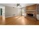 Spacious living room featuring hardwood floors, a brick fireplace, and french doors at 6 Westchester Sq, Decatur, GA 30030