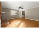 Cozy living room featuring a brick fireplace, built-in shelving, and hardwood flooring at 6 Westchester Sq, Decatur, GA 30030
