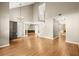 Spacious living room with wood floors, high ceilings and a great view of the entry and staircase at 6 Westchester Sq, Decatur, GA 30030