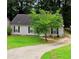 Charming single-story home with gray siding, a well-maintained lawn, and a concrete driveway at 9161 Fairway Ct, Riverdale, GA 30274