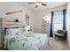 Stylish bedroom featuring a unique headboard, vibrant bedding, and bright curtains at 106 Asher Dr, Carrollton, GA 30116