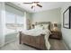Comfortable bedroom featuring a wooden bed frame and soft green walls at 106 Asher Dr, Carrollton, GA 30116