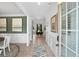 Inviting home foyer featuring beautiful flooring, art, and natural light from the front door at 106 Asher Dr, Carrollton, GA 30116