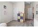 Neutral hallway with rainbow storage and white doors at 106 Asher Dr, Carrollton, GA 30116