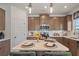 Modern kitchen with granite countertops, stainless steel appliances, and an island with seating at 106 Asher Dr, Carrollton, GA 30116