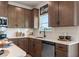 Modern kitchen features stylish brown cabinets, white subway tile backsplash, and stainless steel appliances at 106 Asher Dr, Carrollton, GA 30116