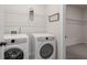 Functional laundry room with modern appliances and ample storage space at 106 Asher Dr, Carrollton, GA 30116