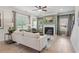 Bright living room has a fireplace, hardwood floors, neutral paint, and large windows with great natural light at 106 Asher Dr, Carrollton, GA 30116