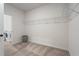 Spacious walk-in closet with carpet and shelving, located just off the laundry room at 106 Asher Dr, Carrollton, GA 30116