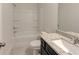 Functional bathroom featuring granite countertops, a shower-tub combo, and ample storage at 3292 Mill Forest Sw Dr, Conyers, GA 30094