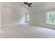 Large bedroom features vaulted ceilings, neutral carpeting, and two windows at 3292 Mill Forest Sw Dr, Conyers, GA 30094
