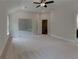 Large bedroom showcasing the neutral color palette and carpet, complemented by abundant natural light at 3292 Mill Forest Sw Dr, Conyers, GA 30094