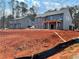 New home construction showcasing the expansive lot and modern architectural design details at 3292 Mill Forest Sw Dr, Conyers, GA 30094