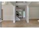 Elegant foyer with hardwood floors, detailed trim, and an inviting staircase at 3292 Mill Forest Sw Dr, Conyers, GA 30094