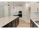 This open-concept kitchen features granite countertops, stainless steel appliances, and plenty of storage space at 3292 Mill Forest Sw Dr, Conyers, GA 30094