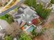 Aerial view showcasing brick home with a backyard pool and lush landscaping at 3821 Teesdale Ct, Atlanta, GA 30350
