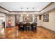Entertaining bar area with a bar-top, seating, hanging pendant lights, and stained concrete floor at 3821 Teesdale Ct, Atlanta, GA 30350