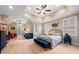 Spacious bedroom with a cozy sitting area, ample natural light, and neutral tones at 3821 Teesdale Ct, Atlanta, GA 30350