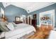 Beautiful bedroom with hardwood floors and a view to another living space at 3821 Teesdale Ct, Atlanta, GA 30350