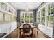 Light-filled dining room with large windows and hardwood floors at 3821 Teesdale Ct, Atlanta, GA 30350