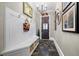 Inviting entryway with custom built-in bench, storage, and stylish tile flooring, perfect for welcoming guests at 3821 Teesdale Ct, Atlanta, GA 30350