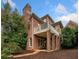 Beautiful two-story brick home featuring a balcony and well-manicured landscaping at 3821 Teesdale Ct, Atlanta, GA 30350