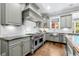Gourmet kitchen featuring custom cabinets, stainless steel appliances, and hardwood floors at 3821 Teesdale Ct, Atlanta, GA 30350
