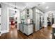 Elegant kitchen with a butler's pantry, a wine fridge, and hardwood floors at 3821 Teesdale Ct, Atlanta, GA 30350