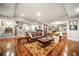 Cozy living room with stained concrete floors, stairs, open floor plan, and area rug at 3821 Teesdale Ct, Atlanta, GA 30350