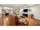 Spacious living room with stained concrete floors, open floor plan, and a leather sofa at 3821 Teesdale Ct, Atlanta, GA 30350