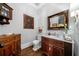Charming powder room featuring a marble countertop and decorative wooden cabinets for an elegant touch at 3821 Teesdale Ct, Atlanta, GA 30350