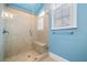 Contemporary shower with glass enclosure, built-in bench, and stylish tile work, offering a spa-like experience at 3821 Teesdale Ct, Atlanta, GA 30350