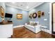 Comfortable sitting room with wet bar, sofa, and hardwood floors at 3821 Teesdale Ct, Atlanta, GA 30350