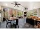 Inviting sunroom with fireplace, seating and a table perfect for entertaining or enjoying the view at 3821 Teesdale Ct, Atlanta, GA 30350