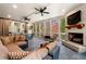 Beautiful sunroom featuring a fireplace, ceiling fans and outdoor views at 3821 Teesdale Ct, Atlanta, GA 30350