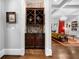 A stylish wine nook features a custom wine rack and dark wood cabinetry at 3821 Teesdale Ct, Atlanta, GA 30350