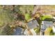 An aerial shot showcases the home's layout, roof, and backyard with a glimpse of the surrounding neighborhood at 713 Shore Ln, Lithonia, GA 30058