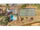 Aerial view showing the community amenities, including a swimming pool and tennis courts, plus a parking lot at 713 Shore Ln, Lithonia, GA 30058