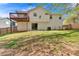Home's back exterior features a deck, patio, and a well-maintained lawn at 713 Shore Ln, Lithonia, GA 30058