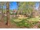 Large, level backyard enclosed by a wood fence, offering privacy and space at 713 Shore Ln, Lithonia, GA 30058